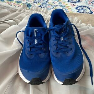 Size 5 blue Nike tennis shoes. Worn only a few times. Smoke free home